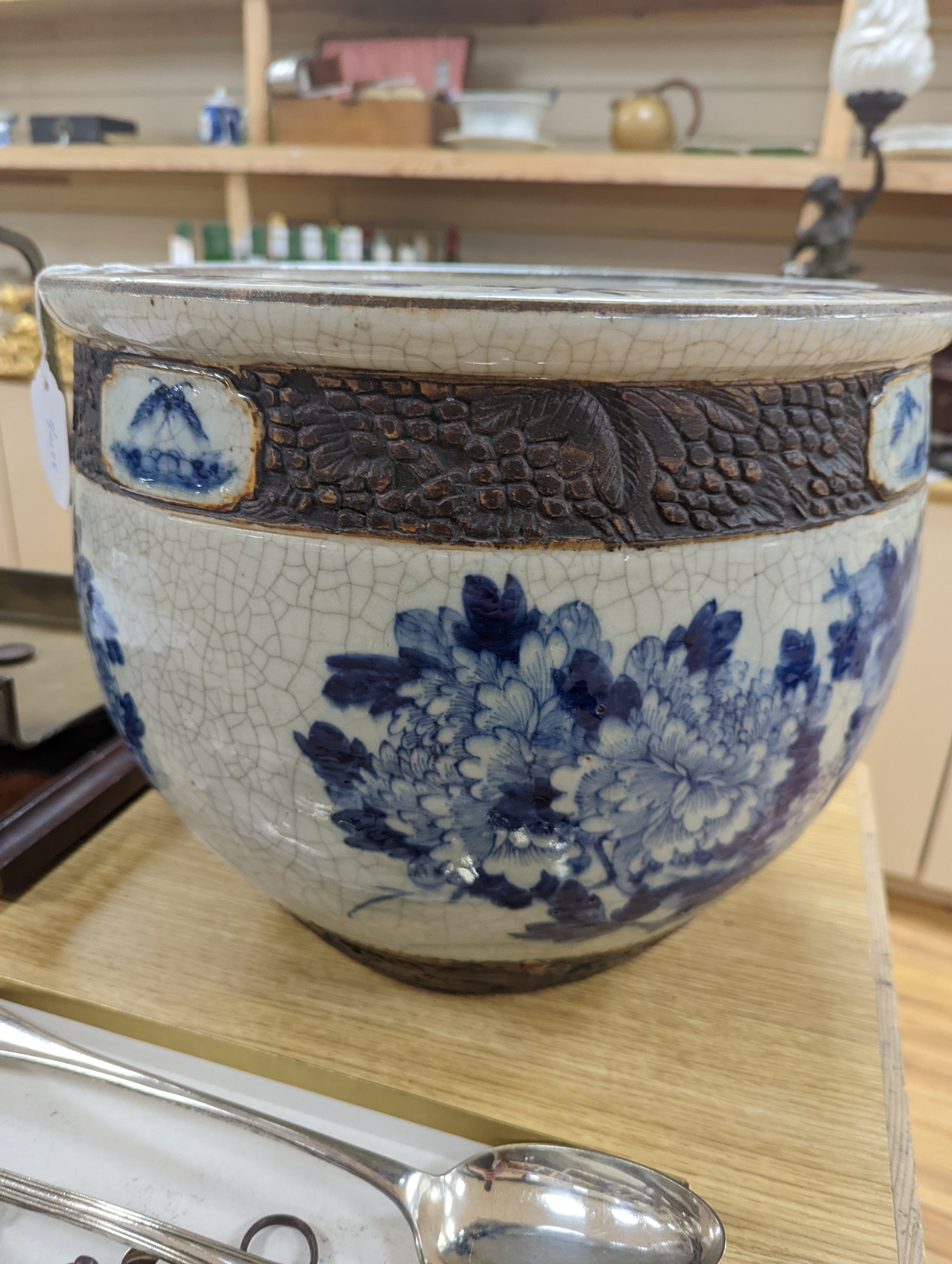 A late 19th/early 20th century Chinese blue and white crackleglaze jardiniere 30cm